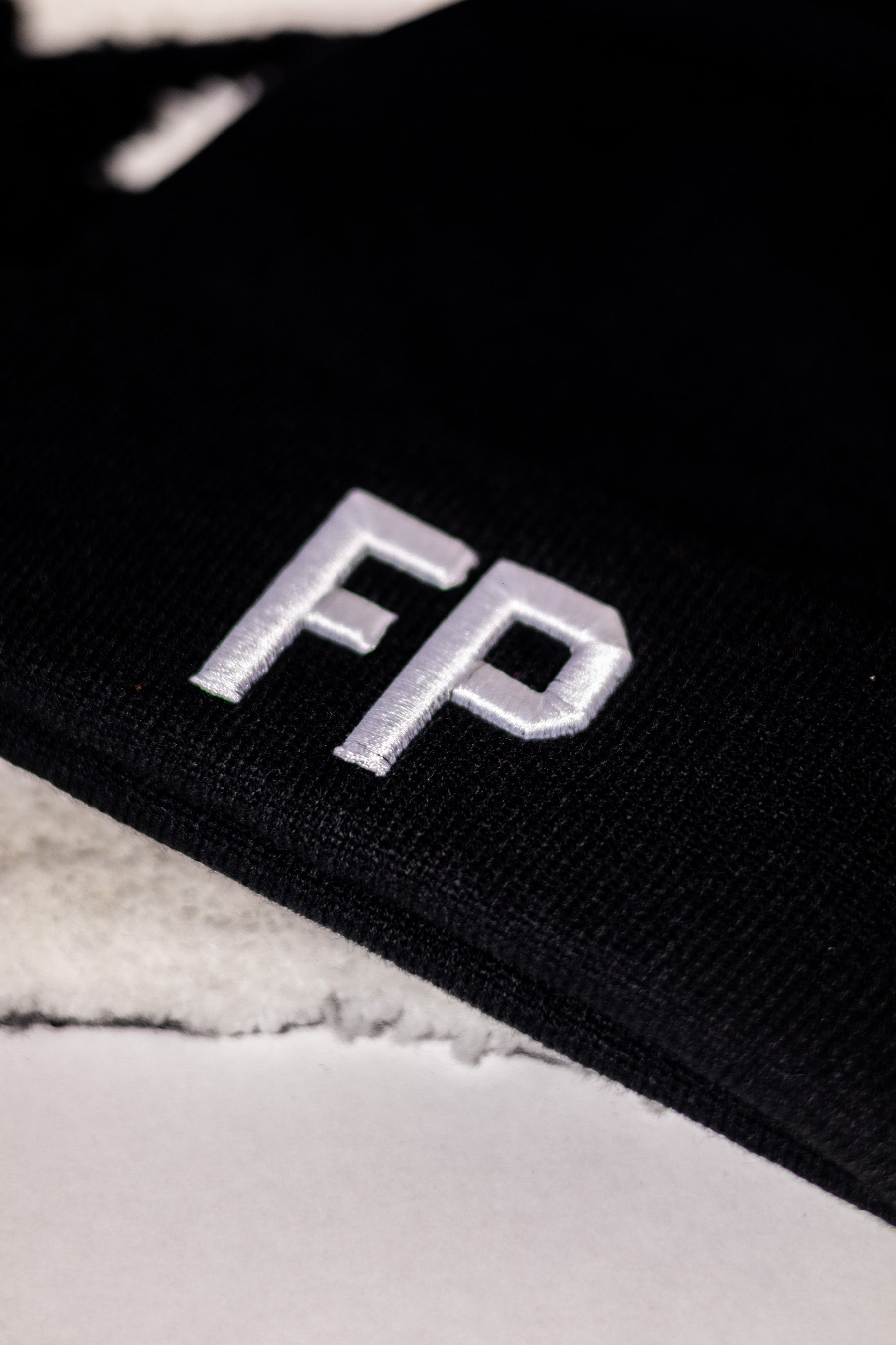 FP WHITE ON BLACK KNITTED BEANIE