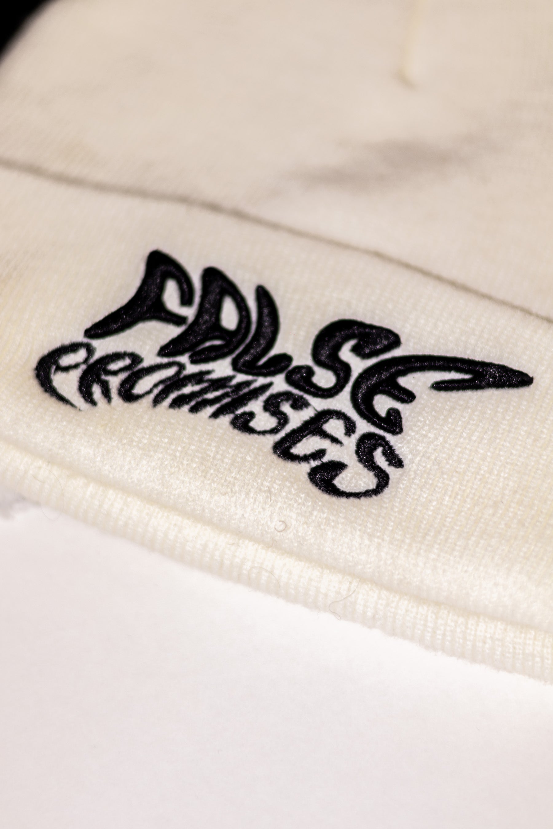 FALSE PROMISES BLACK ON WHITE KNITTED BEANIE