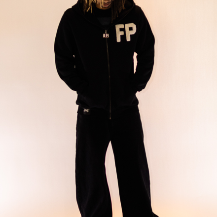 Black heavyweight full-zip hoodie made from 100% French Terry cotton, featuring a custom stainless steel FP zipper, white chenille embroidered FP logo on the front, and chenille embroidery on the hood and back