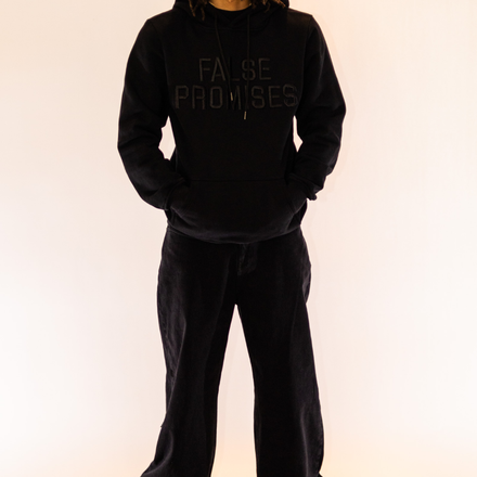 Heavyweight pullover hoodie made from 100% French Terry cotton, featuring a black-on-black minimalist front logo and a distressed denim broken heart design.