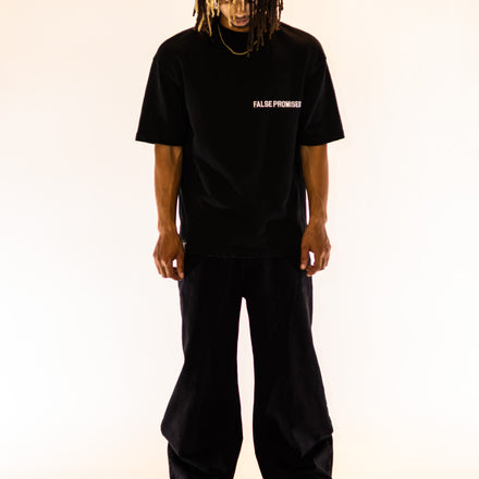 model wearing Oversized t-shirt made from 100% French Terry cotton, featuring a small, minimalist False Promises logo on the front.