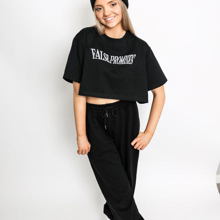 Black women's sweatpants made from 100% French Terry cotton, featuring a relaxed fit with a soft, premium feel.