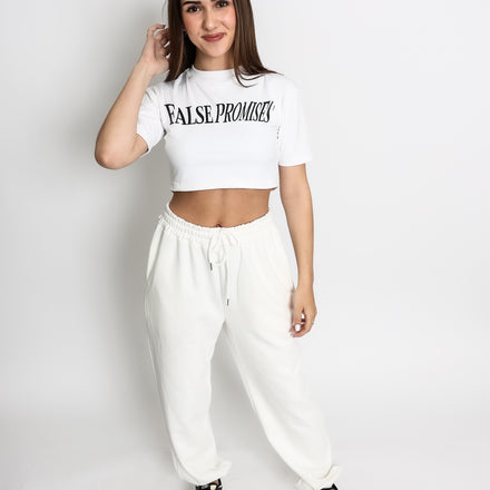 White cropped t-shirt made from a soft polyester and cotton blend, designed for a lightweight, comfortable fit